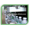 High speed bottle labeler/sleeve applicator